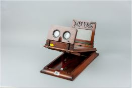 A Victorian mahogany tabletop stereoscope slide viewer stamped 'Abraham & Co, Liverpool', 16 x 9 ins