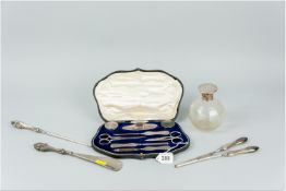 A cased eight piece silver and steel manicure set, a silver handled shoe horn and matching hook, a