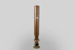 A brass tombstone ship's funnel whistle of cylindrical form on a circular bolt plate with ball valve