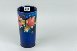 A Moorcroft slender chimney vase of tapering form, all over cobalt blue ground having tube lined