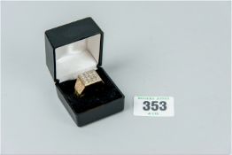 A gent's nine carat gold signet ring with sixteen pavé set diamonds in a square top, size 'V', 10