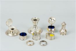 A pair of patterned silver napkin rings, 1.5 ozs, Chester 1901, an oval silver napkin ring and a