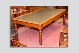 A large pine skiver topped table on substantial turned legs, 95 x 51 ins (242 x 130 cms)