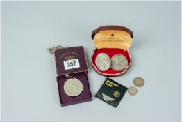 A cased 1951 Festival of Britain crown with mount and possibly silver chain and a small parcel of