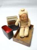 An circa 1920s three-faced doll with rotating head revealing a baby happy, sad and asleep,