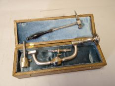 A turn of the century trepanning-brace cased by Stiefenhofer for craniotomy together with cranium