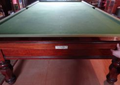 A Burroughes & Watts antique mahogany full-size snooker table, on eight turned and faceted supports,