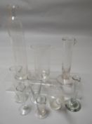 Eight nineteenth century and early twentieth century glass pharmacy measures