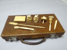 A parcel of ivory items incl. a pair of early nineteenth century Netsukes in the form of two bearded