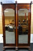 A late nineteenth century mahogany wardrobe by Maple & Co, with two mirrored doors, 89 ins high (226