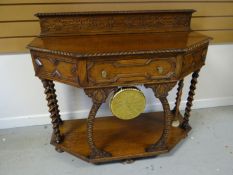 An early-twentieth century rail-back sideboard, on carved supports and with suspended brass dinner