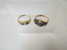 A 9ct yellow gold ring set with three small opals, 2.13gms and another ring, unmarked