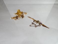 A 9ct antique floral design bar brooch together with a yellow metal basket brooch, unmarked