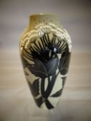 A Moorcroft pottery baluster vase in the 'Summer Silhouette' pattern, 8.25 ins high (21 cms)