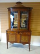 An Edwardian inlaid mahogany cabinet-sideboard, having a bow-front two-door glazed top with shaped