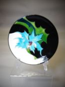 A Moorcroft pottery 'Sea Holly' dish, 6.25 ins diameter (16 cms)