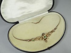 A fine quality cased 15 ct (unmarked) yellow gold rope-twist necklace with a scrolled and floral