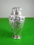 A late Victorian silver caster with raised swirl and floral decoration (damage), 4.3 ozt