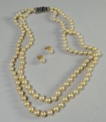 A vintage two-row cultured pearl necklace with bright-cut Sterling silver clasp
