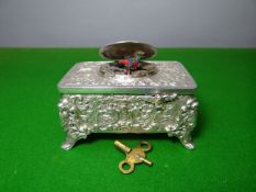 A German EPNS singing-bird automaton, the case highly embossed in the Baroque style with scrolls,