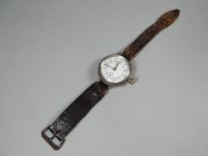 An early-twentieth century manual wind, possibly silver encased, Rolex 'Trench Watch' type