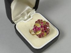 A Middle-East, believed 18ct yellow gold, ring set with a crown of pink rubies, 5.1gms