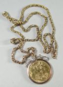 A 1912 full sovereign in a 9ct mount, 9.5 gms attached to a 9ct muff type chain, 7.5 gms