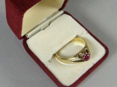 An 18ct yellow gold with single red garnet, 8.19 gms