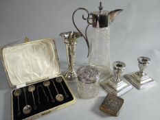 A pair of square based silver candle-holders in the Classical taste; together with a silver