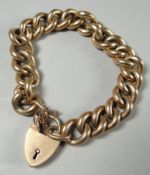 A 9ct yellow gold link bracelet with heart-shaped padlock, 26.11 gms