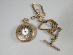 A finely chased 14k yellow gold ladies hunter fob watch, 31.6 gms together with a 9ct link chain
