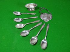 A silver 'PORT' label of floral embossed and mask form; together with a set of six silver