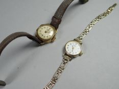 A vintage ROTARY ladies 9ct wristwatch, 12.8gms and another yellow metal watch on brown leather