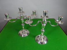 A pair of Elizabeth II silver circular based twin-branch candelabra, London 1967, 49 ozt (24.87 +