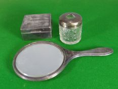 A machine-turned, silver-backed hand-mirror; together with a silver mounted wooden cigarette box and