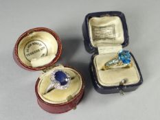 A 9ct yellow gold aquamarine dress ring, 3.2 gms and a white metal (unmarked) oval sapphire and