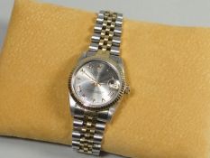 A gentleman's Rolex Oyster Perpetual Datejust mixed metal midi-size wristwatch, having a champagne