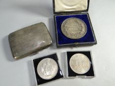 A cased 1909 'Accounting and Banking' medallion; together with a silver cigarette case and two
