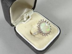 18ct white gold ring with oval opal (11.5mm length) having decorative white gold surround