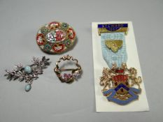 A 9ct yellow gold ribbon brooch set with tiny diamonds and rubies; together with a mosaic brooch,