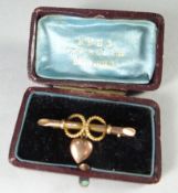 A 9ct yellow gold bar brooch with heart-drop