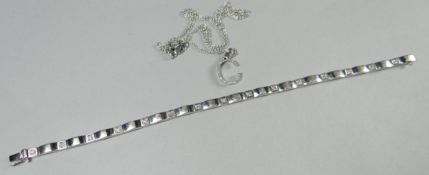 A contemporary 9ct white gold reticulated bracelet set with tiny diamonds; together with a fine
