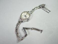 A vintage SMITHS white metal marcasite ladies cocktail wristwatch with heart shaped dial, in