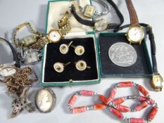 A set of four Edwardian, believed 9ct gold and mother-of-pearl, circular portrait dress-studs;