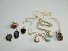 A parcel of yellow gold necklaces and pendants including a small 9ct cameo and an agate swivel