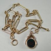A 15ct yellow gold necklace attached to a 9ct yellow gold and agate fob, total weight 53.6 gms
