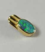 An Australian 18k gold (marked 750) and single opal pendant