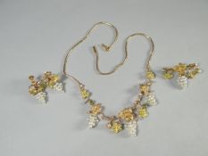 A fine quality, believed 18 ct yellow gold, suite comprising necklace, matching brooch and earrings,