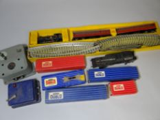 A Hornby Dublo 00-Gauge three-rail train-set comprising tank-locomotive 69567, two carriages and