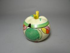 A Clarice Cliff preserve pot and lid in the Apples pattern for the Fantasque Bizarre range